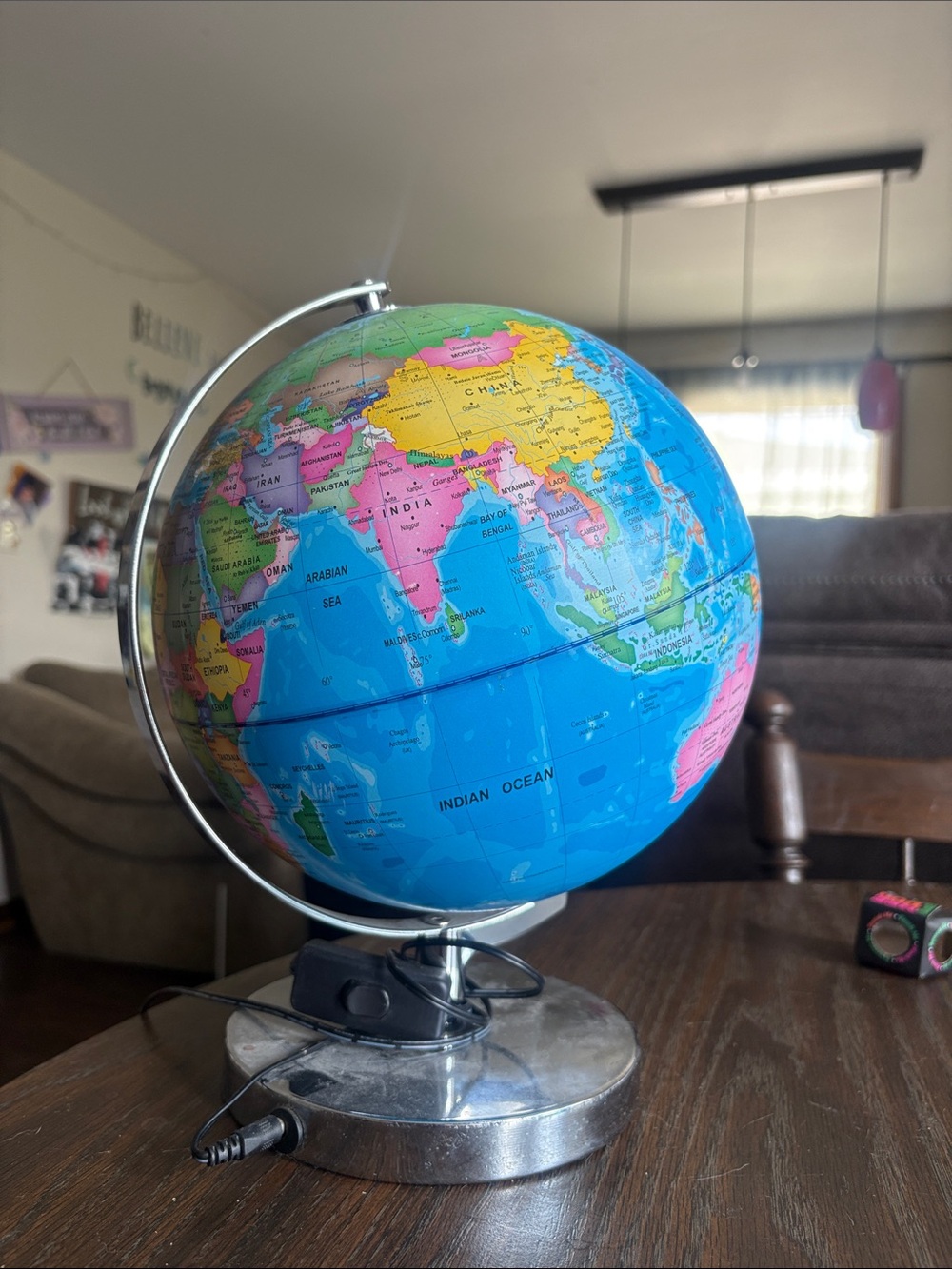 Vibrant Blue World Globe on Silver Stand